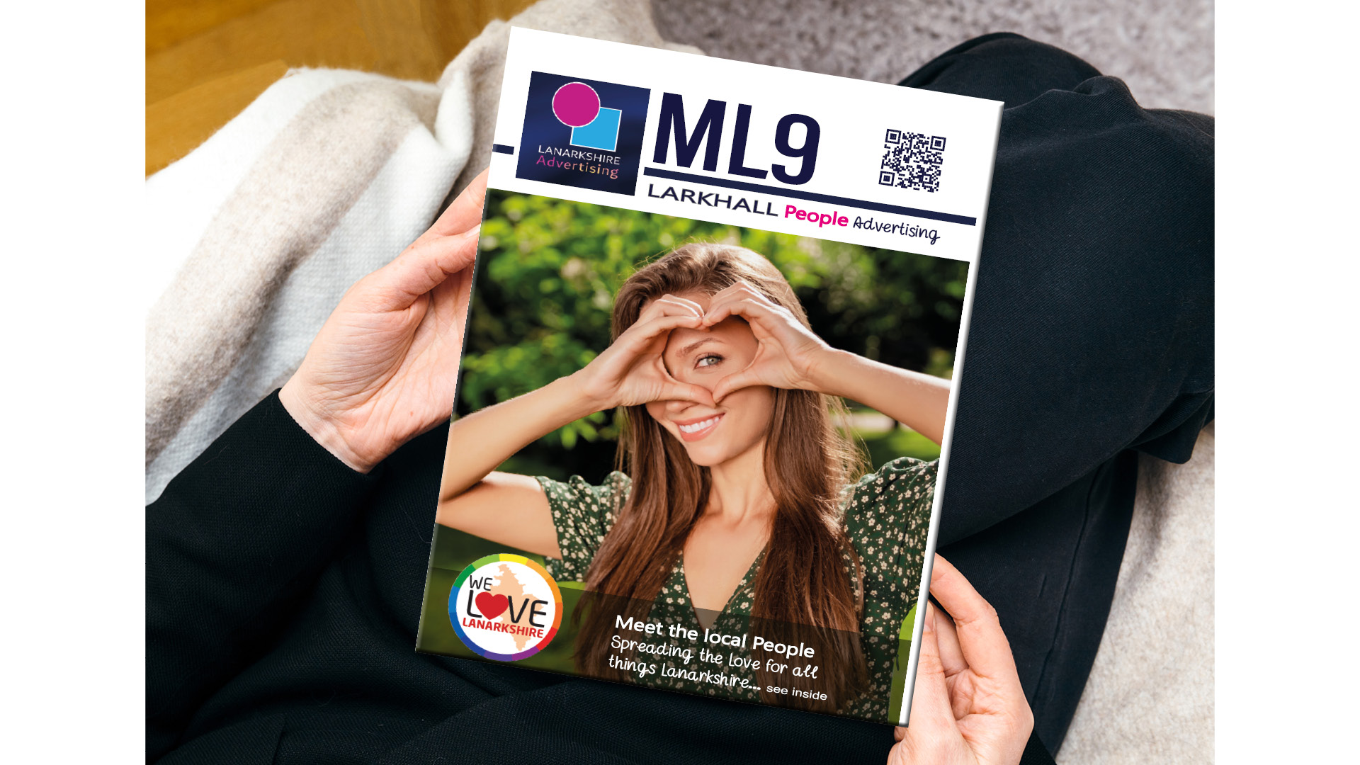 Person holding a Lanarkshire People magazine
